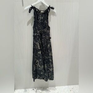 This is a black and cream flower Ulla Johnson dress.